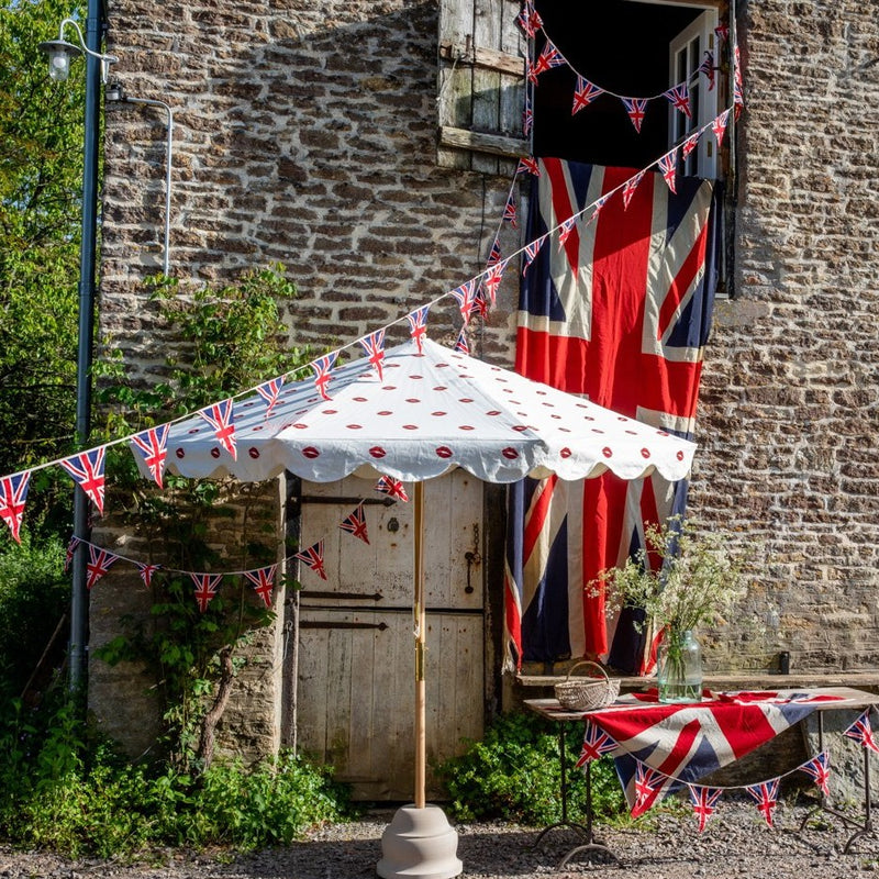 Big Iain 1 Octagonal Parasol with lips and white scolloped edges - pictured with the union jack