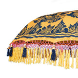 Augusta Round Bamboo Parasol has dark orange threading inside and bamboo spokes. The pole is made from hand-carved durian wood pole with gold paint and finial, the pole join and pegs are made from solid brass. The fringing is in orange with yellow tassels and beading. These are handmade items and there may be some variation in colour.