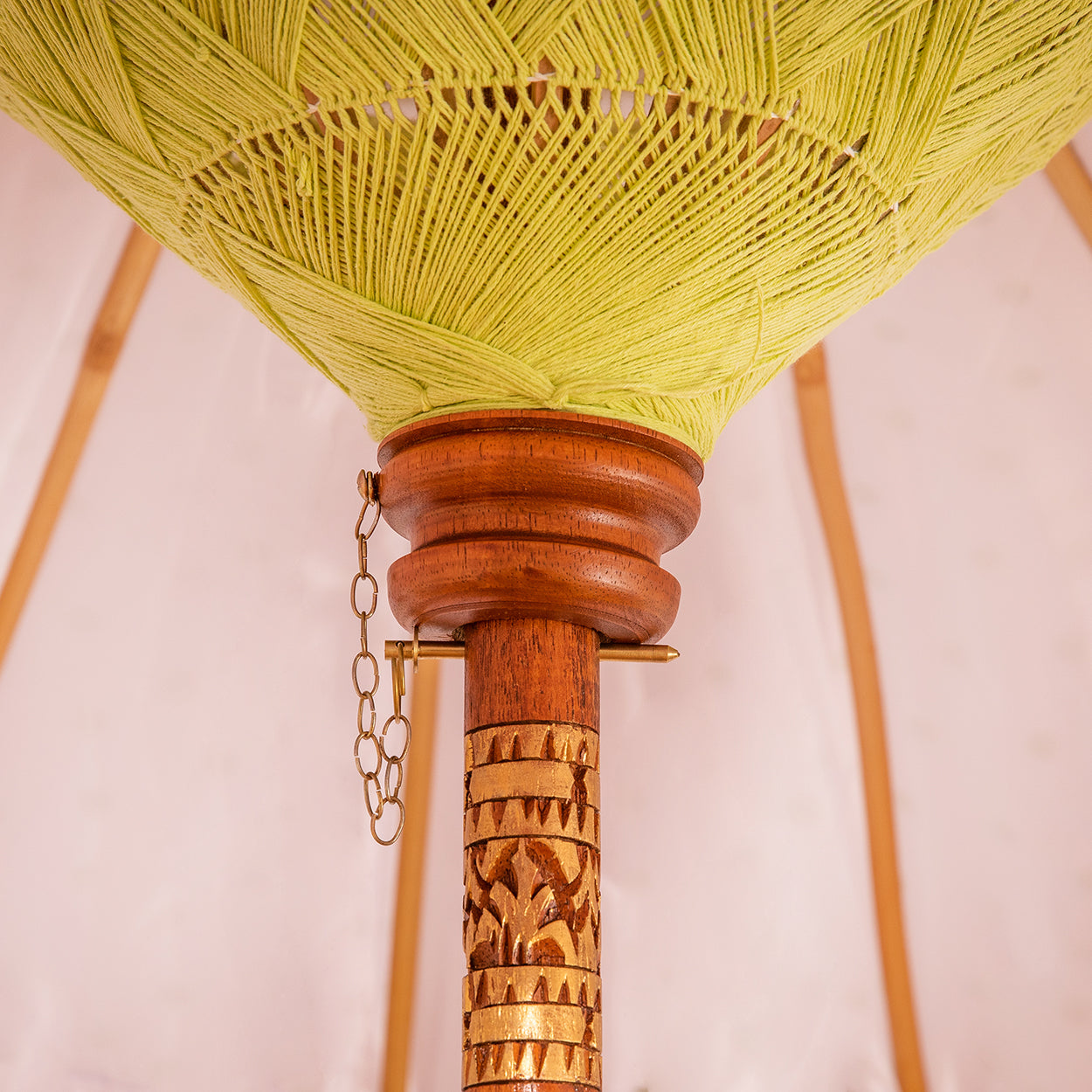 The pole is made from hand-carved durian wood pole with gold paint and finial, the pole join and pegs are made from solid brass.