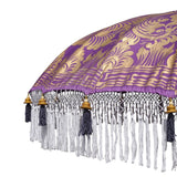 East London Parasol Arlo- purple twill Bali bamboo 2m garden umbrella with lotus design hand painted in gold ink. Tassels in shades of white, hand made. The perfect umbrella for picnics, gardens, summer, patios, pool side and terraces.