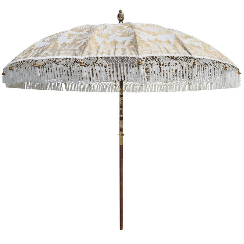 Big Simone- Cream white and gold garden handmade bali parasol with fringing pom poms and beads. A beautiful wooden bamboo 3 meter garden umbrella perfect for a picnic, patio, through your table with an umbrella hole or by your sun lounger at the pool. Make your outdoor space chic, elegant and glamorous with this boho and stylish garden parasol. The most pretty garden decoration for summer.