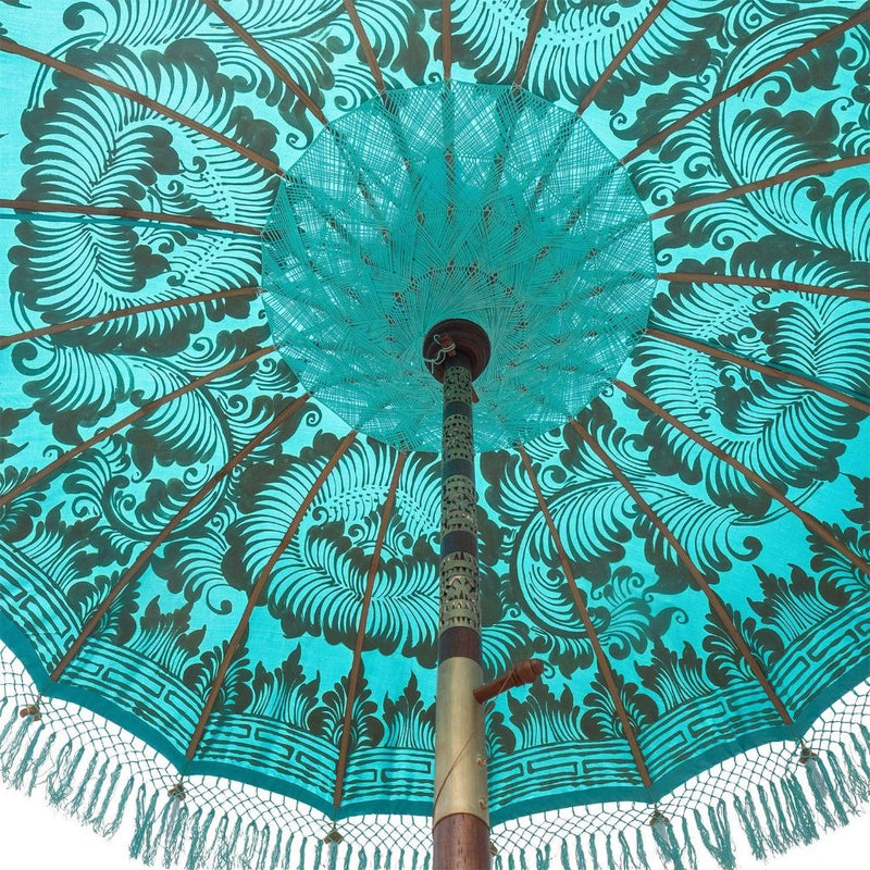 East London Parasol Bette- blue twill Bali bamboo 2m garden umbrella with lotus design hand painted in gold ink. Tassels in shades of blue, hand made. The perfect umbrella for picnics, gardens, summer, patios, pool side and terraces. A very pretty parasol and colourful, luxurious garden decoration for a fabulous summer.