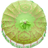 East London Parasol Jane parasol- lime green Bali bamboo 2m garden umbrella with lotus design hand painted in gold ink. Tassels in shades of green and pink, hand made. A beautiful, colourful and luxurious garden decoration to suit any pool, dining table, wedding or cocktail patio. A stylish summer accessory.