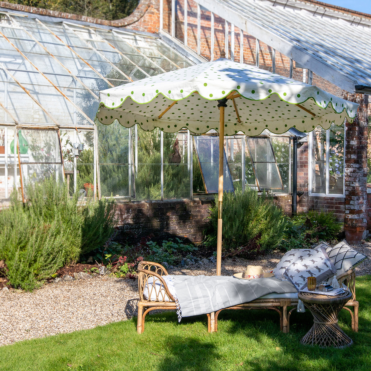 Grace 1 Octagonal Parasol is handcrafted frame made in the UK. Natural cotton canvas with green polka dot pattern outside and inside, and scalloped valance.