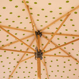 Grace 2 Octagonal Parasol handcrafted frame made in the UK. Natural cotton canvas with white canopy, printed green polka dot pattern inside and scalloped valance.