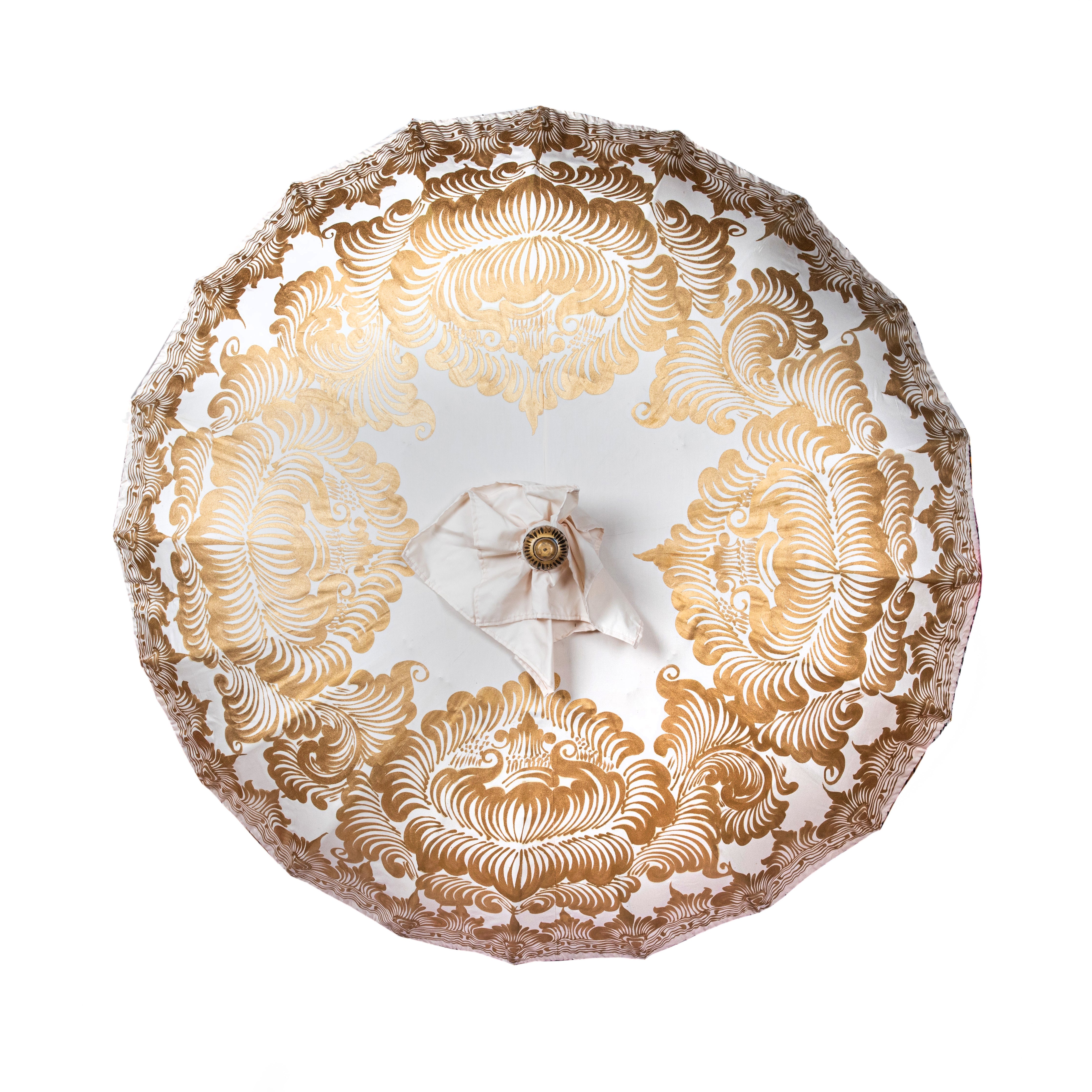 Helena Round Bamboo Parasol - soft beige twill with lotus design hand-painted in gold ink. Inside the threading is vibrant tangerine orange, and the fringe is a combination of peony pink, black and orange tassels.