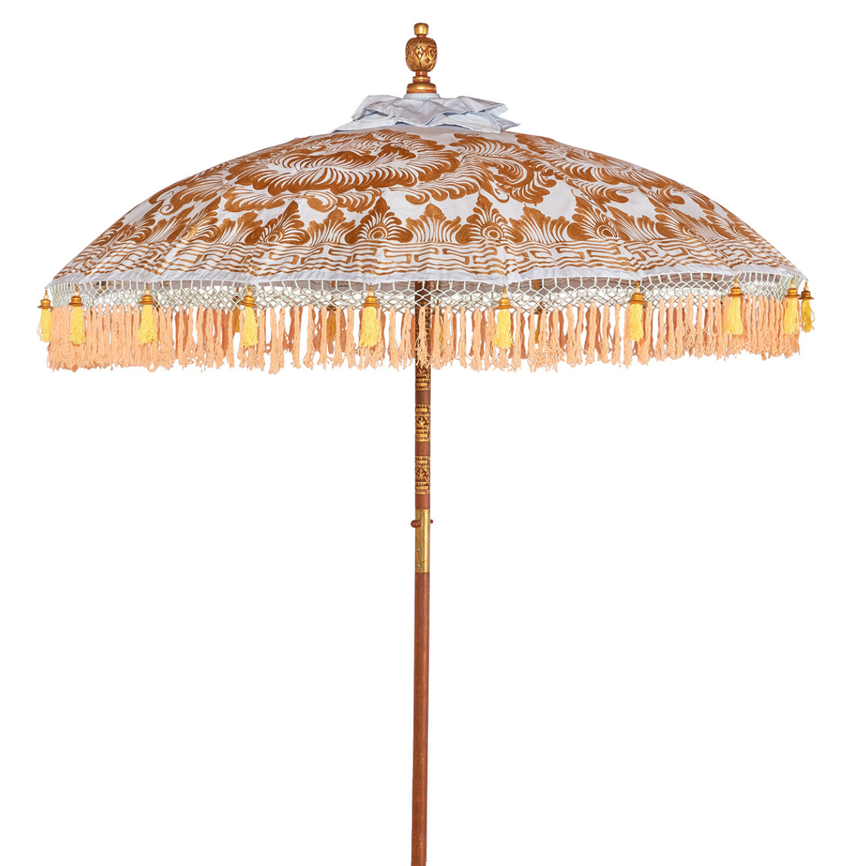 Hugo Round Bamboo Parasol is a pastel heaven with the light blue twill with lotus design hand-painted in gold ink. Yellow threading inside and bamboo spokes. The pole is made from hand-carved durian wood pole with gold paint and finial, the pole join and pegs are made from solid brass. The fringing is in coral with chic yellow tassels and gold beading.