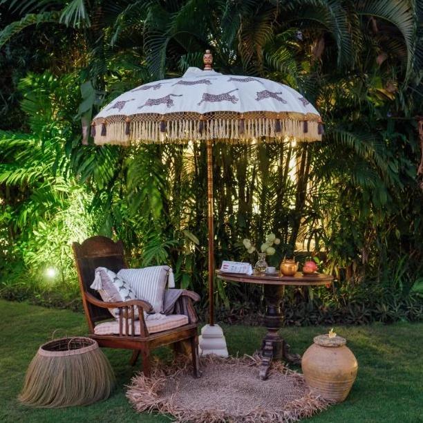 East London Parasol Company Bali Bamboo 2m garden umbrella. Racing leopards leopard print. Handmade and handpainted with fringing and tassels in shades of white