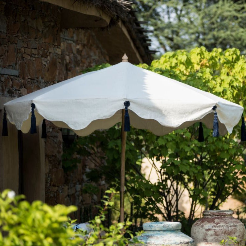 Big Lexi, 3m width waterproof canvas Garden parasol in natural cotton  with flying birds in grey, red and indigo blue on the inside. Screen printed garden umbrella with stunning indigo tassels. Elegant, chic and calming, the ultimate luxury garden decoration. The canopy is easily removable. The perfect umbrella for gardens, summer, patios, pool side and terraces. A fabulous garden accessory for a party.