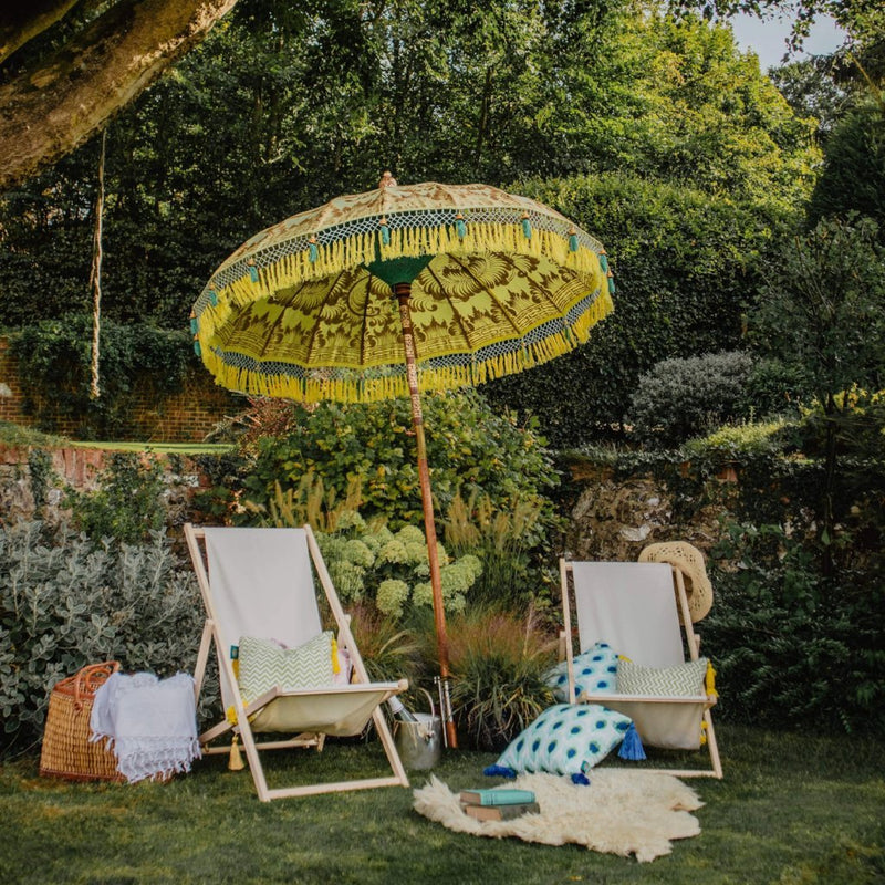 East London Parasol Company Bali Bamboo 2m garden umbrella. Goldie- yellow and gold with tassels. Handmade and handpainted with yellow and green fringing.
