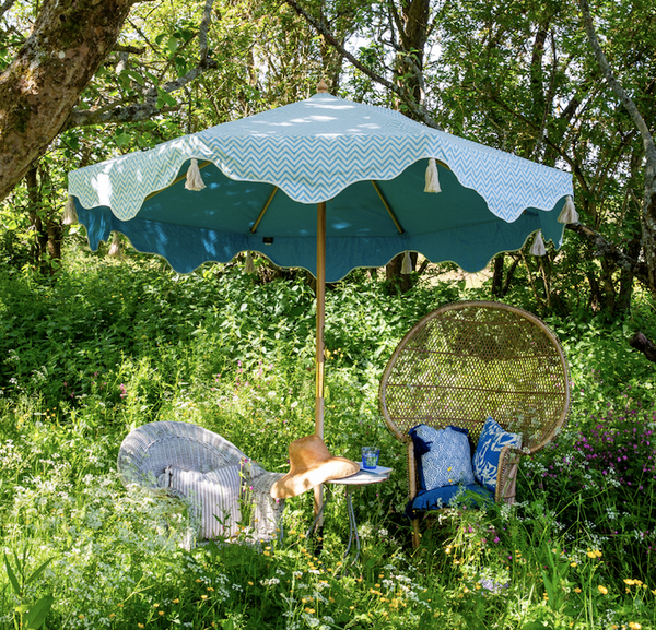 Blue Aretha Octagonal parasol made with blue and white zig zag canopy, sustainable ash wood frame