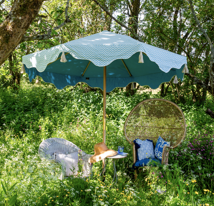 Blue Aretha Octagonal parasol made with blue and white zig zag canopy, sustainable ash wood frame