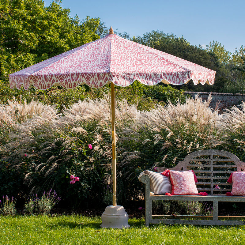 Sophia 1 Octagonal Parasol natural cotton canvas with digital pink ikat printed pattern outside and white inside, and scalloped valance. FSC certified ash frame made in Hampshire with our own designs of brass fittings and pulleys