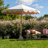 Sophia 2 Octagonal Parasol has a natural cotton canvas with white outside and pink ikat print inside, and scalloped valance. FSC certified ash frame made in Hampshire with our own designs of brass fittings and pulleys.