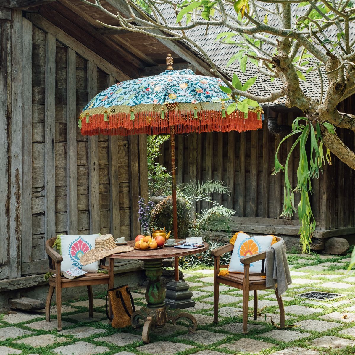 Glorious orange and blue garden cushion. Perfectly matching our summer parasols and handmade in block printed cotton with lovely tassels. The most luxurious and colourful decoration for house and garden. Beautiful summer lunch accessory. William Morris Liberty print.