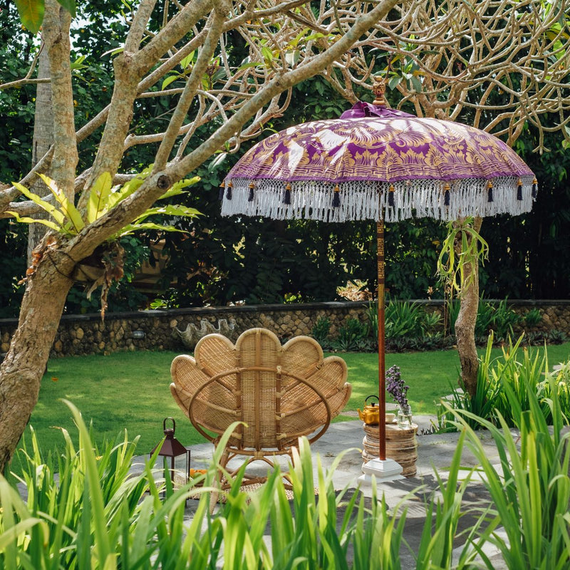 East London Parasol Arlo- purple twill Bali bamboo 2m garden umbrella with lotus design hand painted in gold ink. Tassels in shades of white, hand made. The perfect umbrella for picnics, gardens, summer, patios, pool side and terraces.