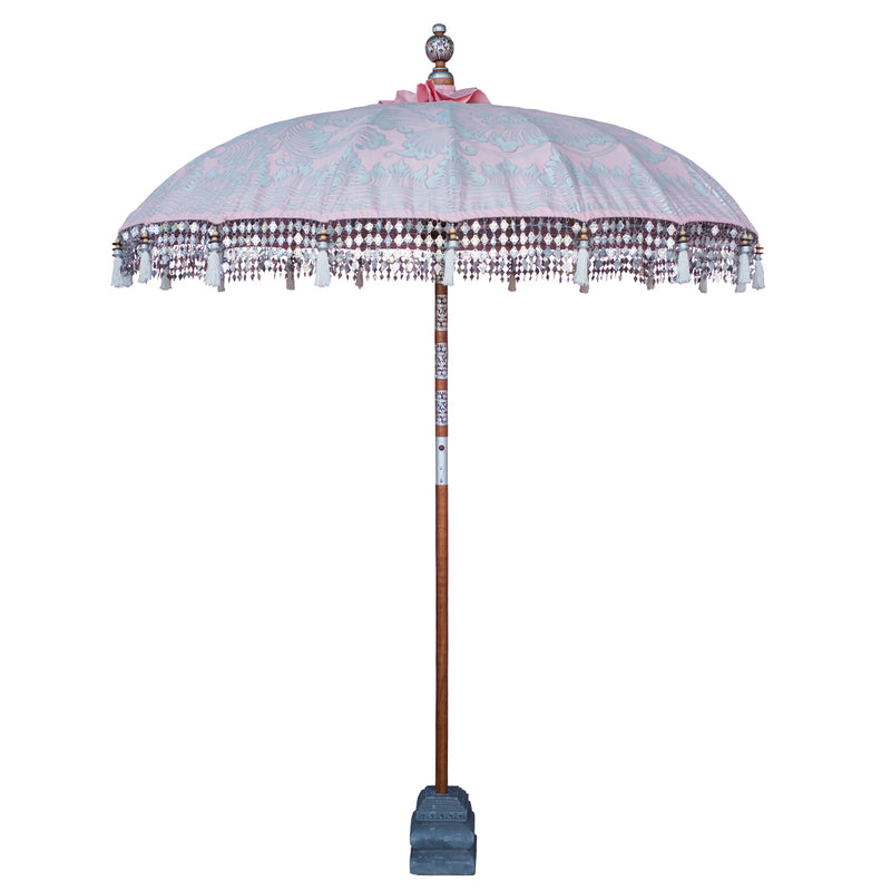 Stevie Round Bamboo Parasol- Pale pink twill garden parasol with floral design hand painted in silver ink. The pole is made from hand-carved durian wood pole with silver paint and finial, the pole join and pegs are made from solid brass with white threading, bamboo spokes.